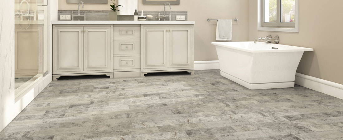 Gray bathroom tile room scene with light blue accents