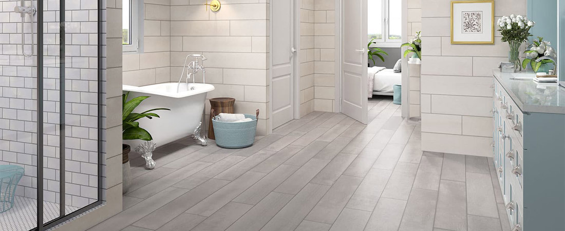 Gray bathroom tile room scene with light blue accents